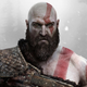 Kratos stares intensely into the distance in God of War.